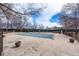 Community pool with a cover surrounded by a fence and landscaping at 7770 W 38Th Ave # 207, Wheat Ridge, CO 80033