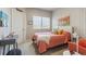 Inviting bedroom with a bright window, comfortable bed, and accent chair at 12820 Inca St, Westminster, CO 80234