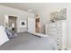 Cozy bedroom with a comfortable bed, dresser, and stylish artwork at 12820 Inca St, Westminster, CO 80234