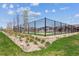 Community tennis court surrounded by lush landscaping and neighborhood homes at 12820 Inca St, Westminster, CO 80234