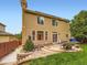Spacious backyard featuring a patio and tall trees, providing plenty of space to unwind at 2544 S Fundy Cir, Aurora, CO 80013
