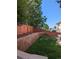 Fenced backyard with a stone retaining wall at 2544 S Fundy Cir, Aurora, CO 80013