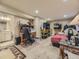 Spacious carpeted basement with office area, storage racks and access to bathroom at 2544 S Fundy Cir, Aurora, CO 80013