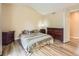 Bedroom features a vaulted ceiling, wood-style floors, and neutral-toned walls at 2544 S Fundy Cir, Aurora, CO 80013