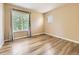 Bedroom features hardwood floors, neutral walls, and natural light at 2544 S Fundy Cir, Aurora, CO 80013