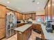 Spacious kitchen features an island, stainless steel appliances, and granite countertops at 2544 S Fundy Cir, Aurora, CO 80013