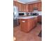 Updated kitchen with stainless steel appliances and a large center island at 2544 S Fundy Cir, Aurora, CO 80013