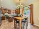 Well-equipped kitchen with modern appliances, island, and a dining area leading to the backyard at 2544 S Fundy Cir, Aurora, CO 80013