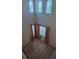 Bright, open living room with laminate flooring and tall windows at 2544 S Fundy Cir, Aurora, CO 80013