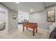 Finished basement features a carpeted floor, recessed lighting, and a foosball table for entertainment at 11046 Pastel Pt, Parker, CO 80134