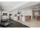 Finished basement including a bar, lounge area, and exercise equipment at 11046 Pastel Pt, Parker, CO 80134
