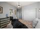 room with a sports theme, featuring decorations, an attached bathroom and large closet at 11046 Pastel Pt, Parker, CO 80134
