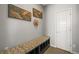 Cozy entryway with custom bench seating and storage at 11046 Pastel Pt, Parker, CO 80134