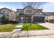 Charming two-story home with a well-manicured lawn, inviting entryway, and attached two-car garage at 11046 Pastel Pt, Parker, CO 80134
