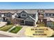 Charming two-story home with a well-manicured lawn, inviting curb appeal, and a convenient attached garage at 11046 Pastel Pt, Parker, CO 80134