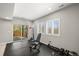 Home gym with rubber flooring, sliding glass door to the outside, and updated equipment at 11046 Pastel Pt, Parker, CO 80134