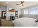 Comfortable bedroom featuring a flat screen tv, and plenty of natural light from the shutters at 11046 Pastel Pt, Parker, CO 80134