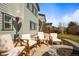 Backyard patio with chairs, a fire pit, and views of the two-story home at 11046 Pastel Pt, Parker, CO 80134