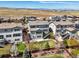 Aerial view of the home showcasing backyard with patio, lawn, and well-maintained landscaping at 11046 Pastel Pt, Parker, CO 80134