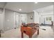 Open recreation room featuring a foosball table, connecting rooms, and ample lighting at 11046 Pastel Pt, Parker, CO 80134