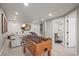 Finished recreation room with a foosball table and access to an adjacent bathroom at 11046 Pastel Pt, Parker, CO 80134