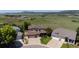 Aerial view of a charming home nestled in a lush green neighborhood with picturesque mountain views at 4099 Starflower Rd, Castle Rock, CO 80109