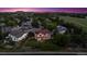 Aerial view showcases a backyard, neighborhood homes, and a picturesque evening sky at 4099 Starflower Rd, Castle Rock, CO 80109