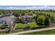 Aerial view of a well-maintained backyard with a patio, green lawn and a fence at 4099 Starflower Rd, Castle Rock, CO 80109