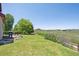 Picturesque backyard with lush lawn, a patio with seating, and a tranquil pasture view, great for relaxing outdoors at 4099 Starflower Rd, Castle Rock, CO 80109