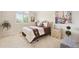 Bedroom with neutral carpet, plantation shutters, and decoratively pillowed queen bed at 4099 Starflower Rd, Castle Rock, CO 80109