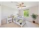Bright bedroom with a single bed, window, and a decorative plant at 4099 Starflower Rd, Castle Rock, CO 80109