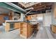 Bright open kitchen features stainless steel appliances, granite countertops, and hardwood floors at 1515 N Ogden St # 7, Denver, CO 80218