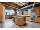 Spacious open concept kitchen with modern appliances, a large island, and exposed brick accents at 1515 N Ogden St # 7, Denver, CO 80218