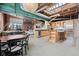 Bright open living space features exposed brick, skylights, modern lighting, and hardwood floors at 1515 N Ogden St # 7, Denver, CO 80218