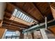 Unique loft featuring wood ceiling with a skylight and exposed ductwork at 1515 N Ogden St # 7, Denver, CO 80218