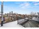 Outdoor roof deck offers stunning views of the city skyline and ample space for entertaining at 1515 N Ogden St # 7, Denver, CO 80218