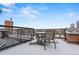 Rooftop deck with outdoor seating offers city views, perfect for relaxing or entertaining guests at 1515 N Ogden St # 7, Denver, CO 80218
