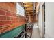 Unique staircase featuring metal railings, open wooden treads, and exposed brick, adding architectural interest at 1515 N Ogden St # 7, Denver, CO 80218