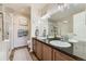 Bathroom with double sink vanity, granite countertop and a glass shower stall at 1897 S Buchanan Cir, Aurora, CO 80018