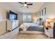 Bedroom with white furniture, including an entertainment center with a large TV at 1897 S Buchanan Cir, Aurora, CO 80018