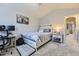 Bedroom features a bed, office desk, and vaulted ceiling at 1897 S Buchanan Cir, Aurora, CO 80018