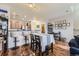 Open dining area with kitchen bar and hardwood floors. Lots of room to entertain at 1897 S Buchanan Cir, Aurora, CO 80018