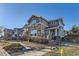 Charming townhome featuring stone accents, well-maintained landscaping, and inviting entryways at 1897 S Buchanan Cir, Aurora, CO 80018