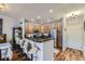 Well-lit kitchen with stainless steel appliances and a breakfast bar with seating at 1897 S Buchanan Cir, Aurora, CO 80018