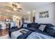 Open-concept living room and kitchen with hardwood floors and a comfortable sofa at 1897 S Buchanan Cir, Aurora, CO 80018