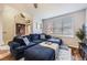 Cozy living room featuring a large sectional sofa, perfect for relaxation at 1897 S Buchanan Cir, Aurora, CO 80018