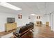 Spacious basement with hardwood floors, lots of light, and versatile layout at 8484 E Radcliff Ave, Denver, CO 80237