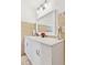 This stylish bathroom includes modern fixtures, a vanity with marble top, and tiled floors at 8484 E Radcliff Ave, Denver, CO 80237