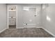 Finished basement with access to bathroom featuring a white vanity and laundry room at 8051 Clarkson Ct, Denver, CO 80229