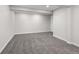 Finished basement features new carpet and neutral walls at 8051 Clarkson Ct, Denver, CO 80229